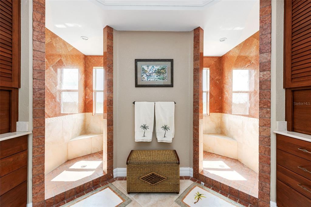 1420 Beach Road, Unit 204 Englewood, FL 34223 - Photo 38 of 99 a living room with furniture and a floor to ceiling window