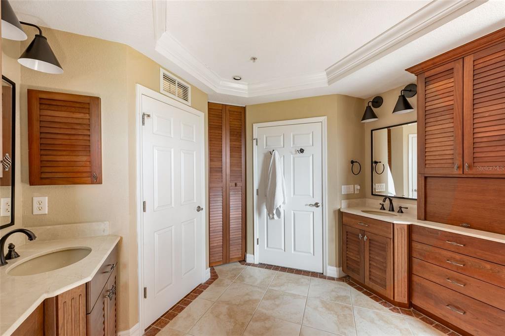 1420 Beach Road, Unit 204 Englewood, FL 34223 - Photo 40 of 99 a bathroom with a sink and a mirror