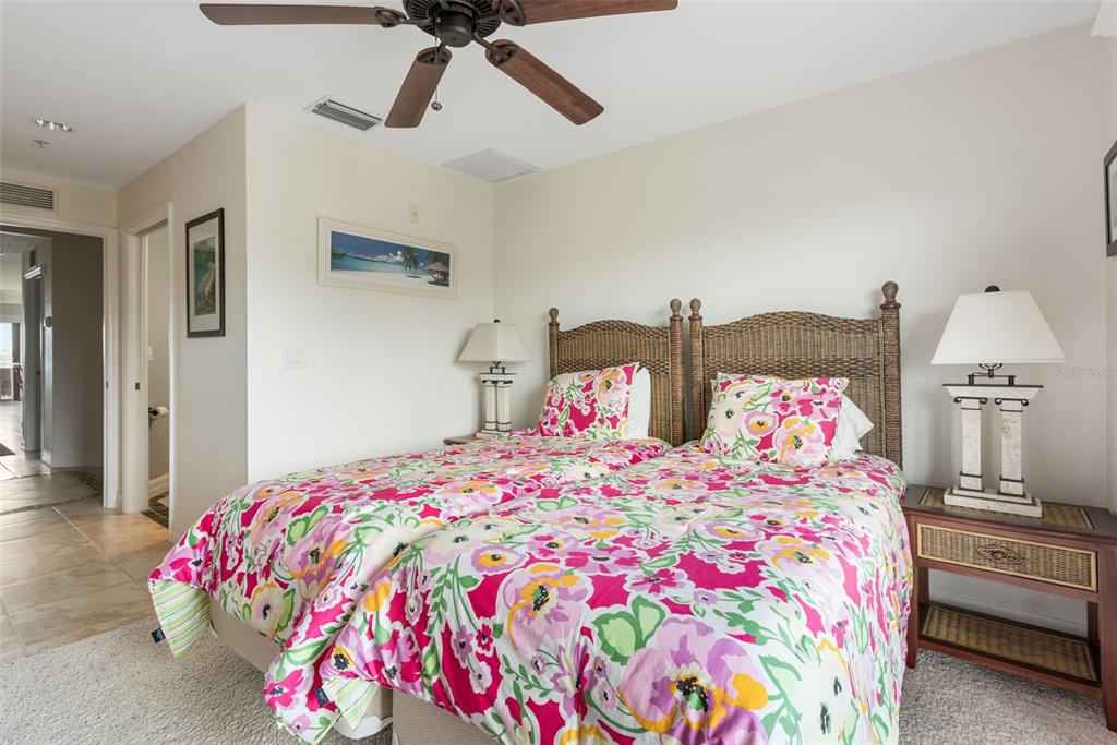 1420 Beach Road, Unit 204 Englewood, FL 34223 - Photo 50 of 99 a bedroom with two beds and painted walls