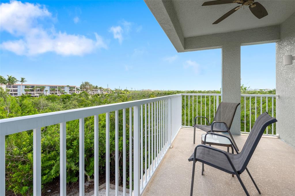 1420 Beach Road, Unit 204 Englewood, FL 34223 - Photo 52 of 99 a view of a chair and table in the balcony