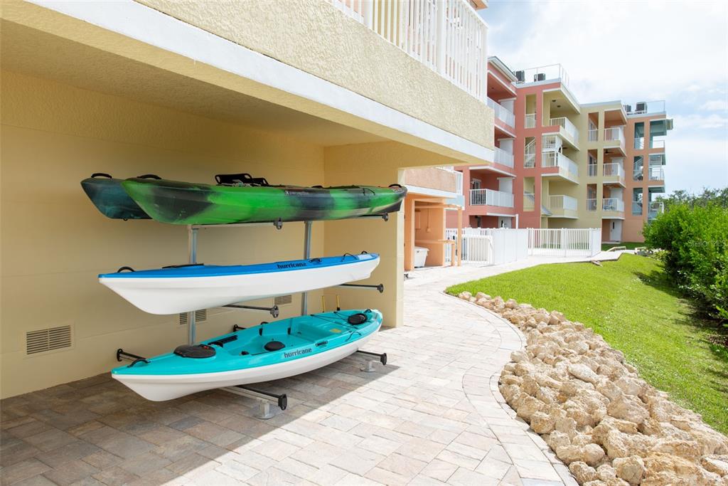 1420 Beach Road, Unit 204 Englewood, FL 34223 - Photo 56 of 99 a view of a building with a yard