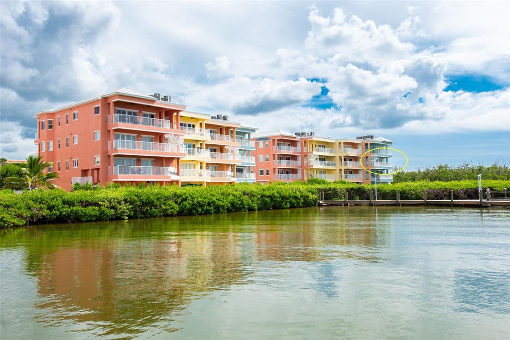 1420 Beach Road, Unit 204 Englewood, FL 34223 - Photo 62 of 99 a front view of a building with lake view