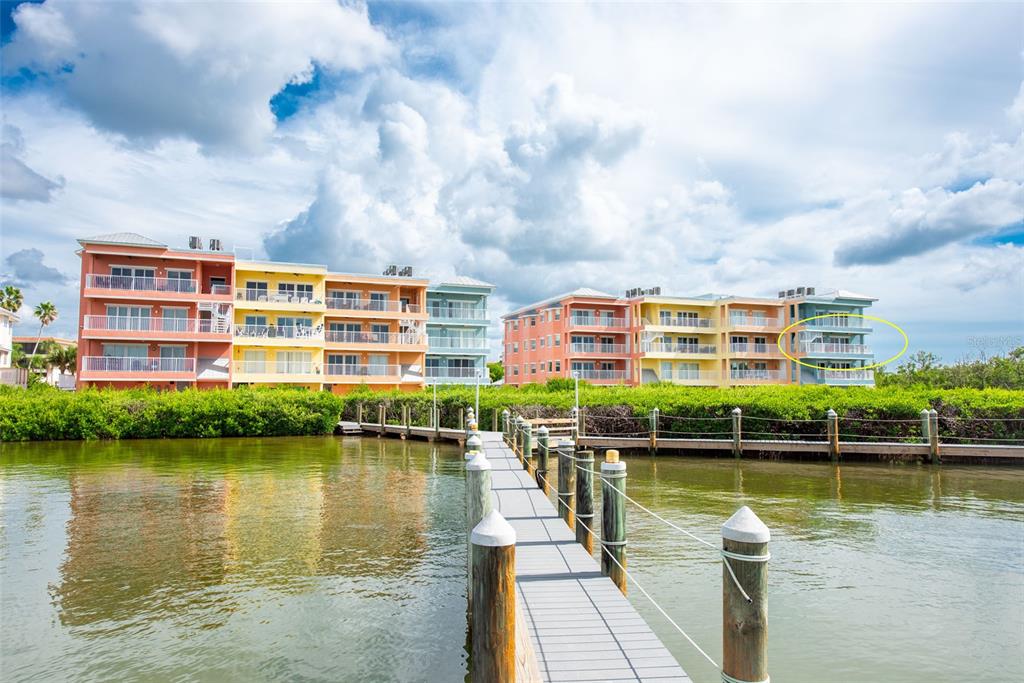 1420 Beach Road, Unit 204 Englewood, FL 34223 - Photo 64 of 99 a view of a lake with a building in the background