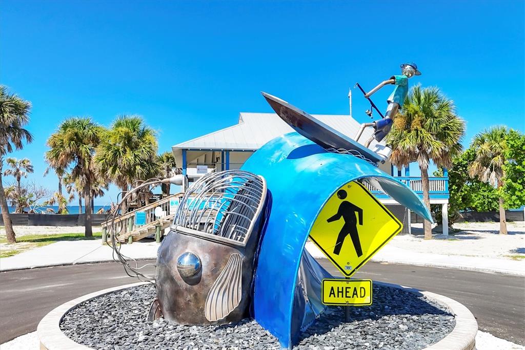 1420 Beach Road, Unit 204 Englewood, FL 34223 - Photo 68 of 99 a view of a street with a palm tree