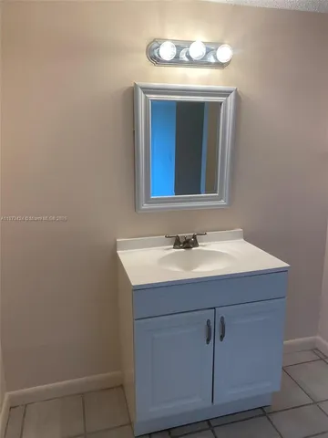 a white toilet sitting next to a bathtub