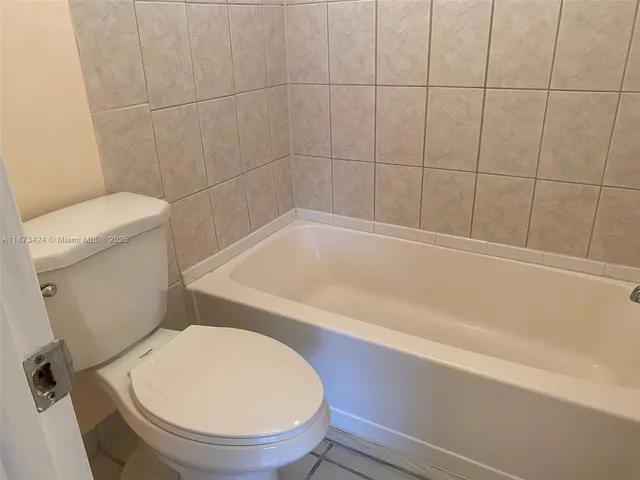 a view of a balcony with an tree