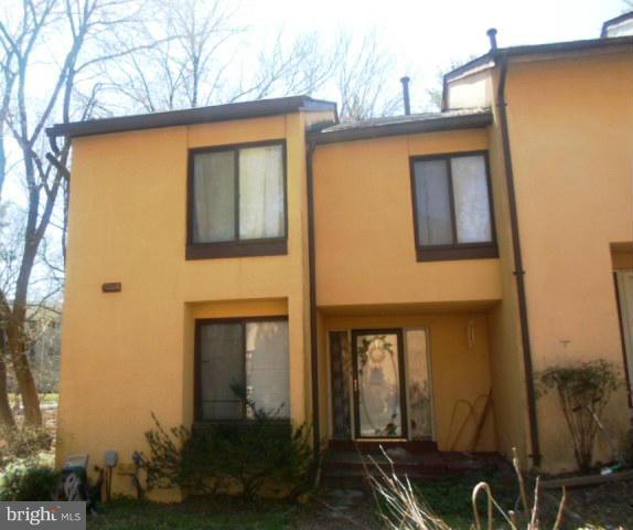 9682 Basket Ring Road Columbia, MD 21045 - Photo 1 of 8 a front view of a house with garden