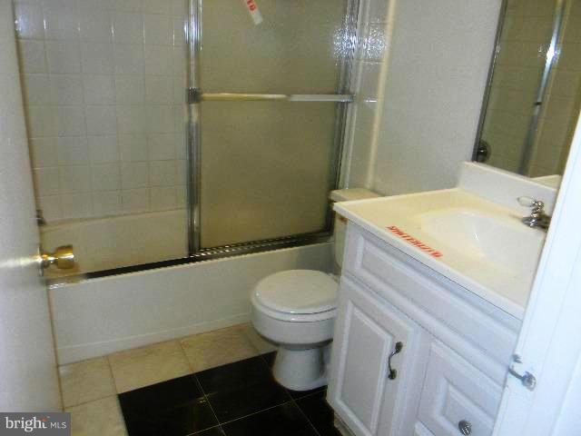 9682 Basket Ring Road Columbia, MD 21045 - Photo 6 of 8 a bathroom with a sink toilet and shower