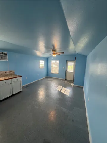 a view of an empty room and window