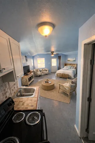 a view of a backyard with sitting area