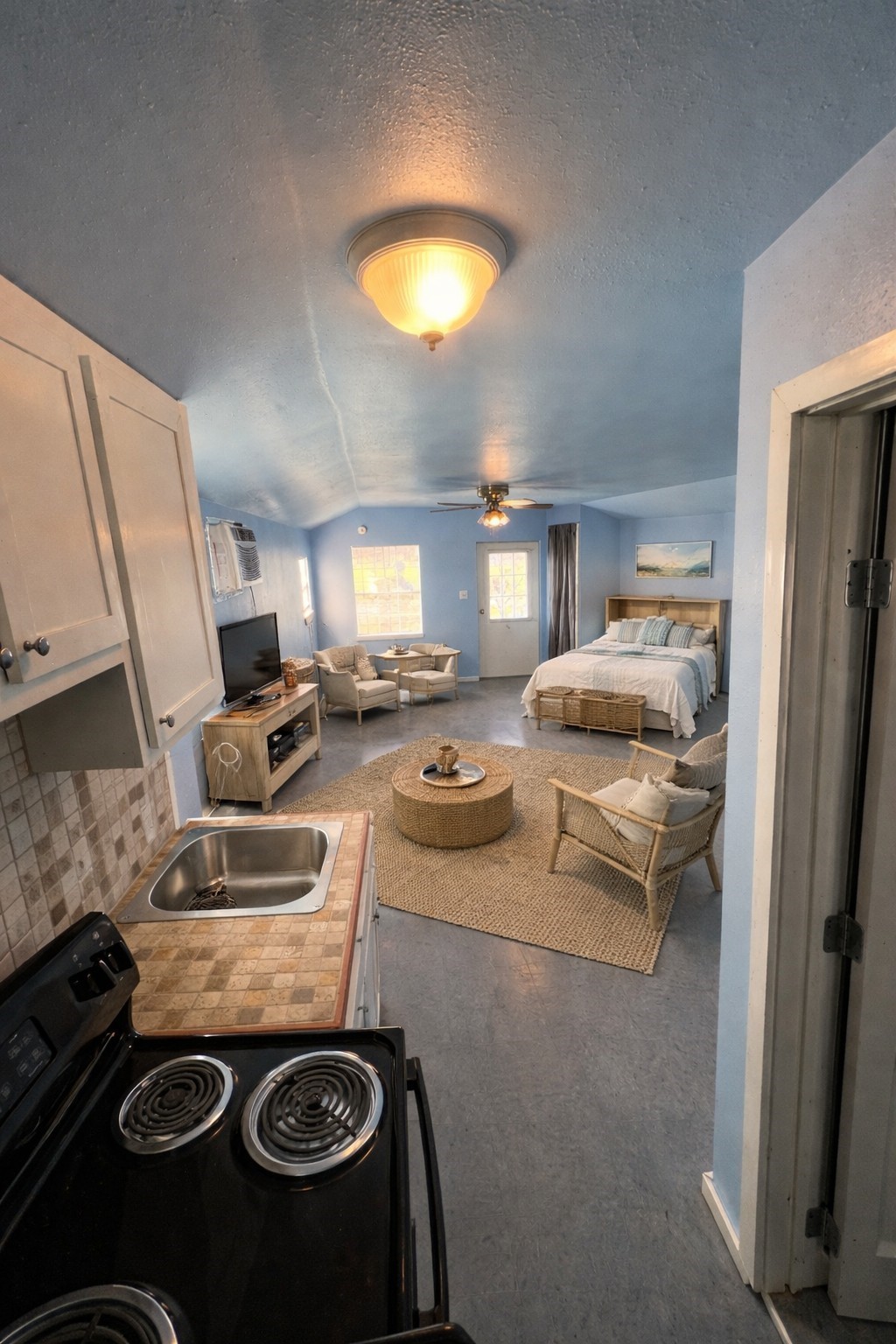 327 17th Street San Leon, TX 77539 - Photo 21 of 23 a kitchen with a stove and a refrigerator