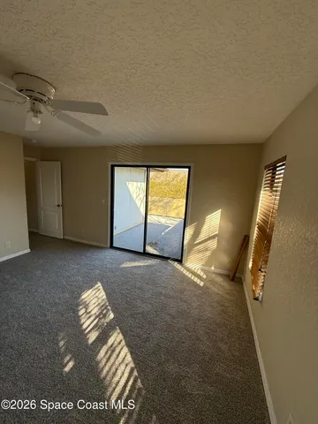 a view of empty room with windows