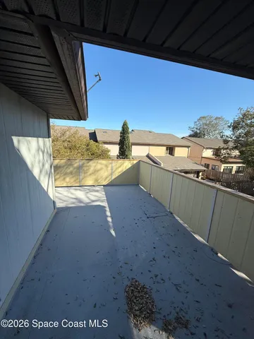 an empty room with a empty space and windows