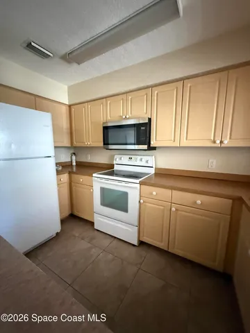 a view of a kitchen with a sink