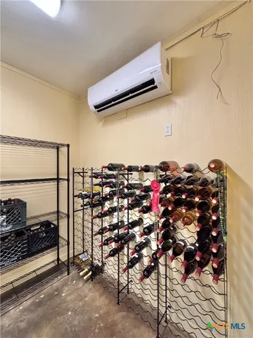 a bathroom with a granite countertop sink a mirror and shower