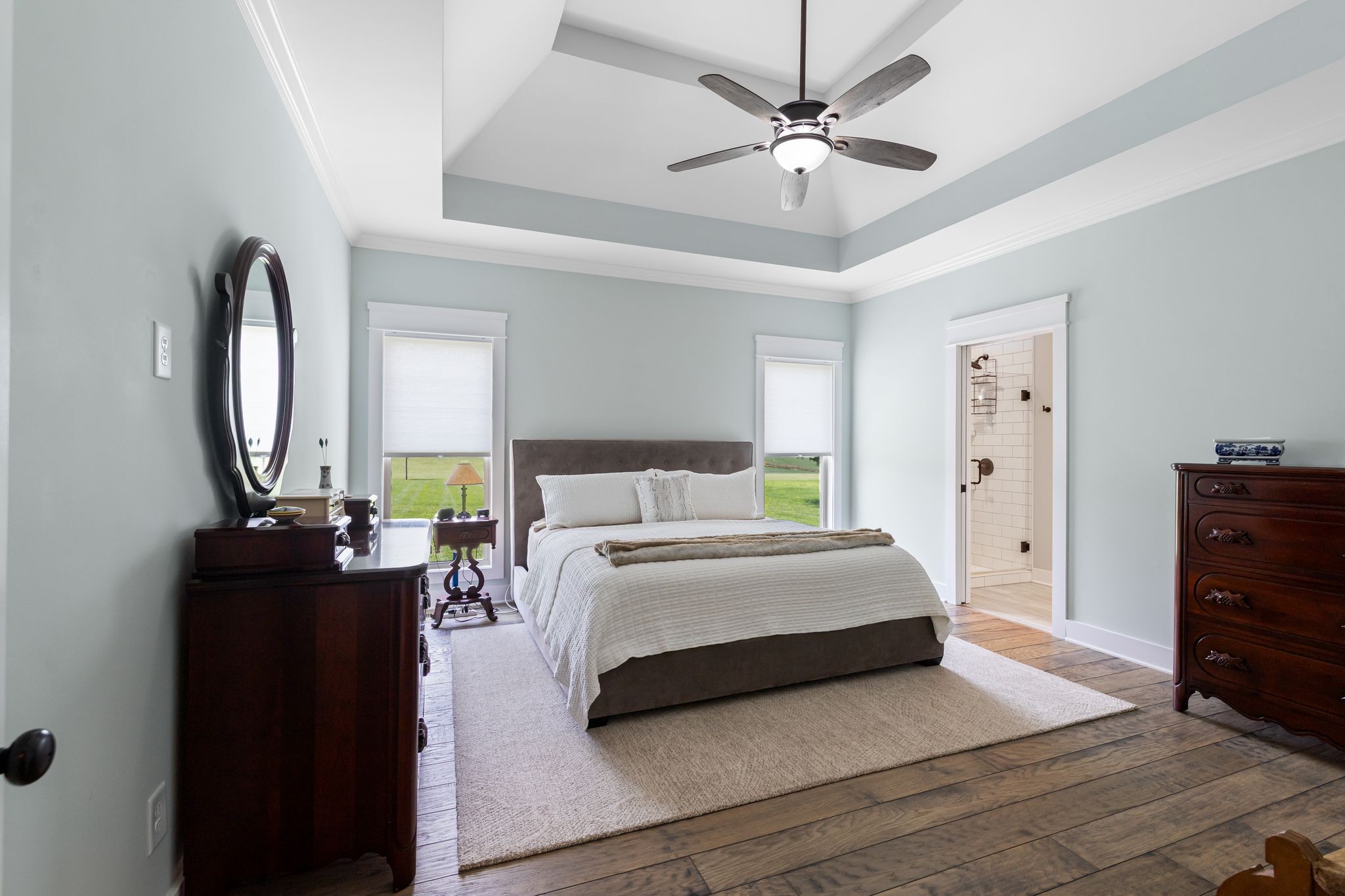 467 Halltown Road Portland, TN 37148 - Photo 17 of 33 a spacious bedroom with a bed a dresser and a chandelier