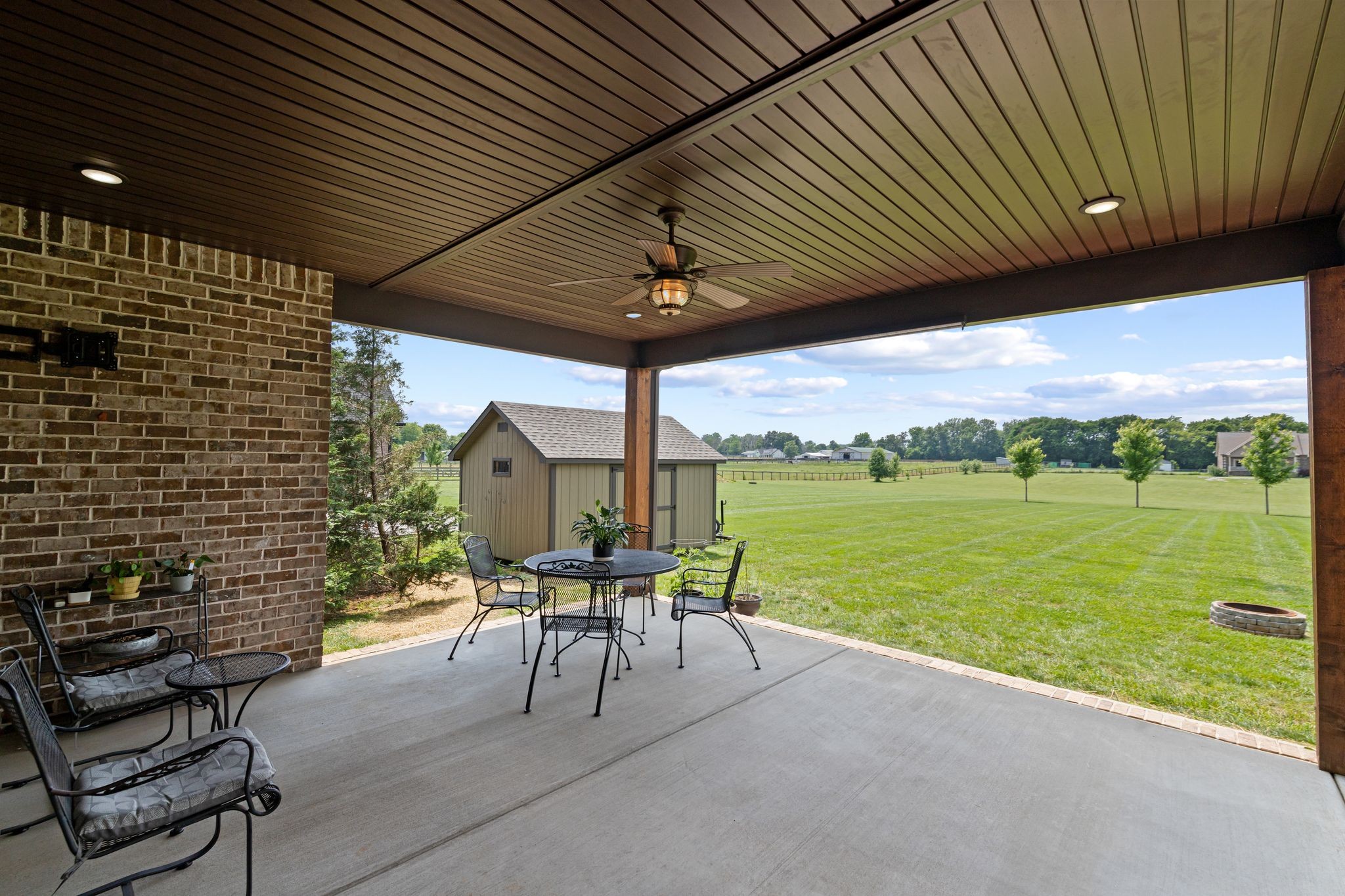 467 Halltown Road Portland, TN 37148 - Photo 30 of 33 a view of a patio with a table chairs and a backyard
