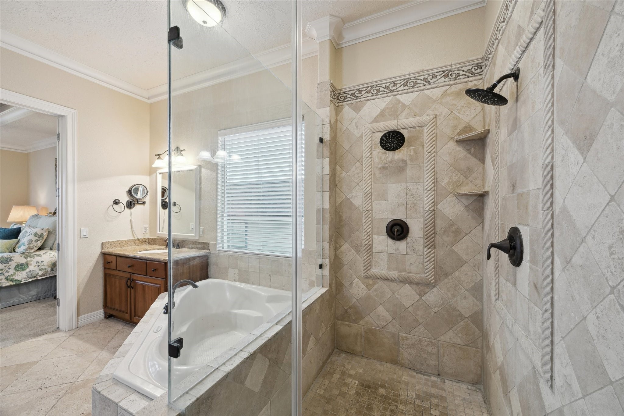 1406 Todville Road Seabrook, TX 77586 - Photo 37 of 50 THE WALK-IN SHOWER OFFERING DOUBLE SHOWER HEADS AND FRAMELESS GLASS SURROUND.