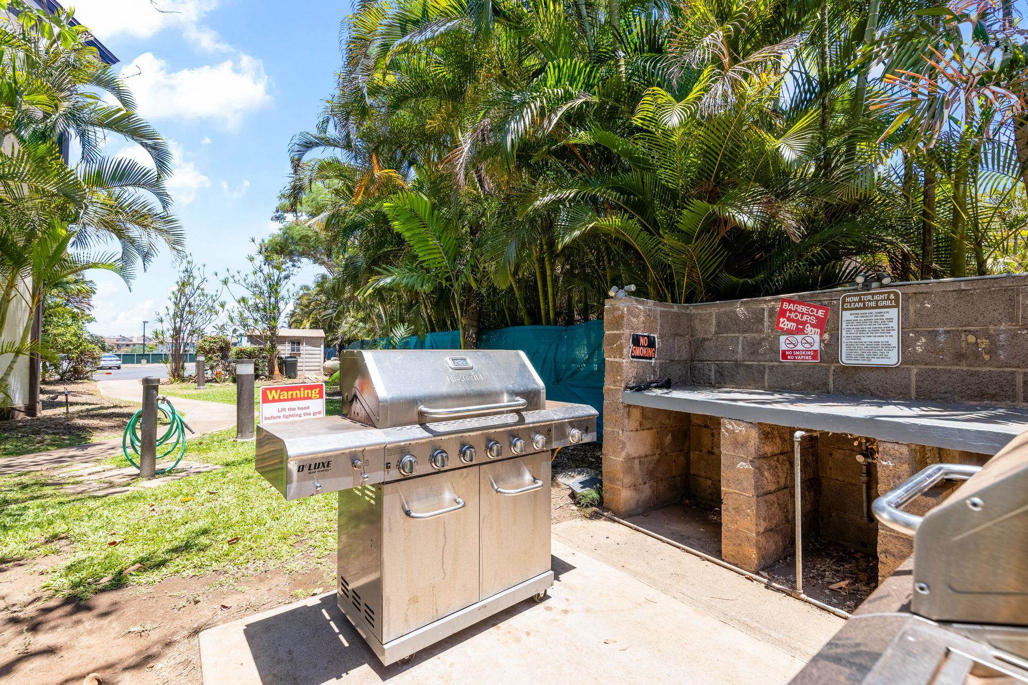 777 South Kihei Road, Unit 105 Kihei, HI 96753 - Photo 20 of 27 a view of a kitchen with a stove and a large tree