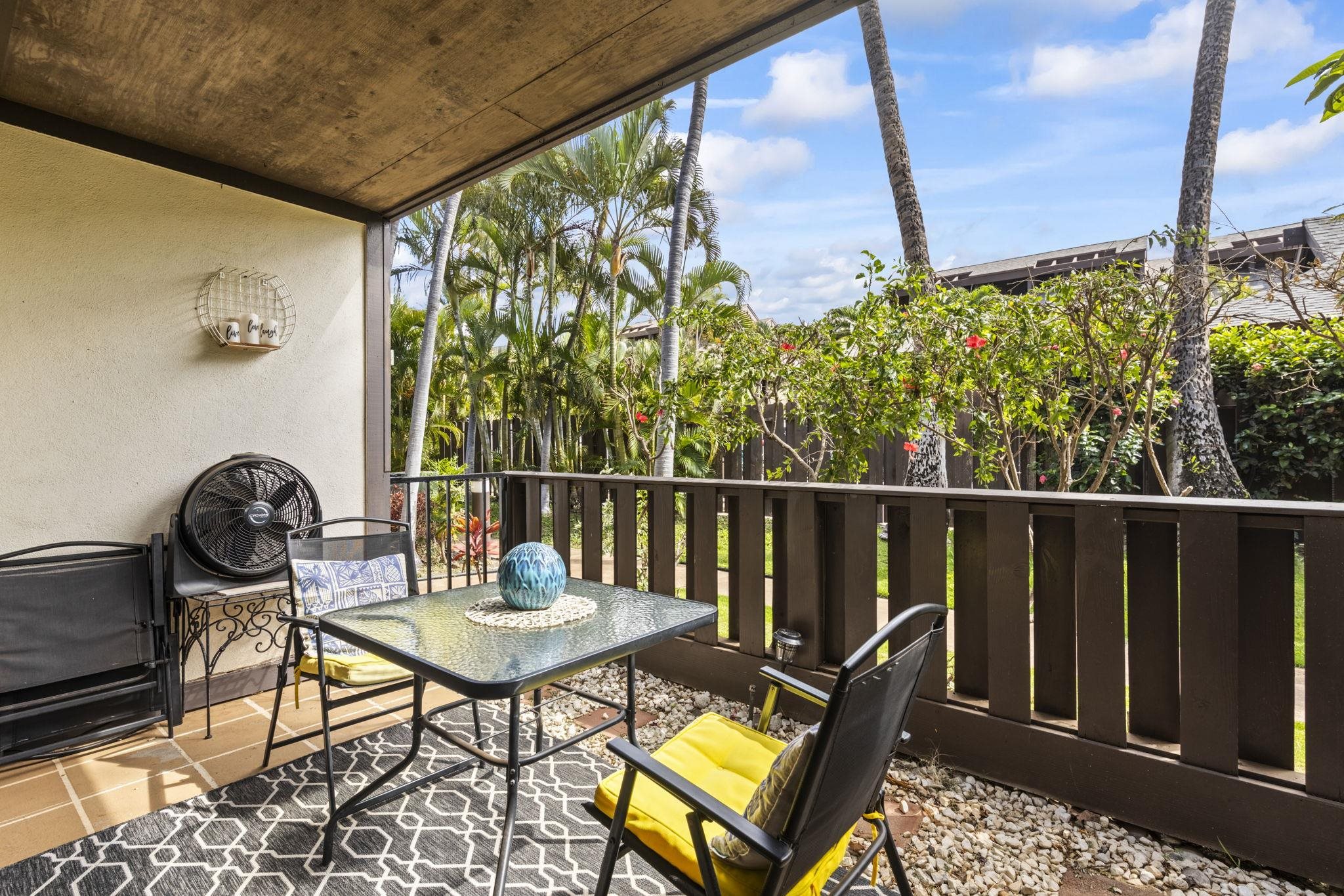 777 South Kihei Road, Unit 105 Kihei, HI 96753 - Photo 22 of 27 a view of a balcony with chairs and a table