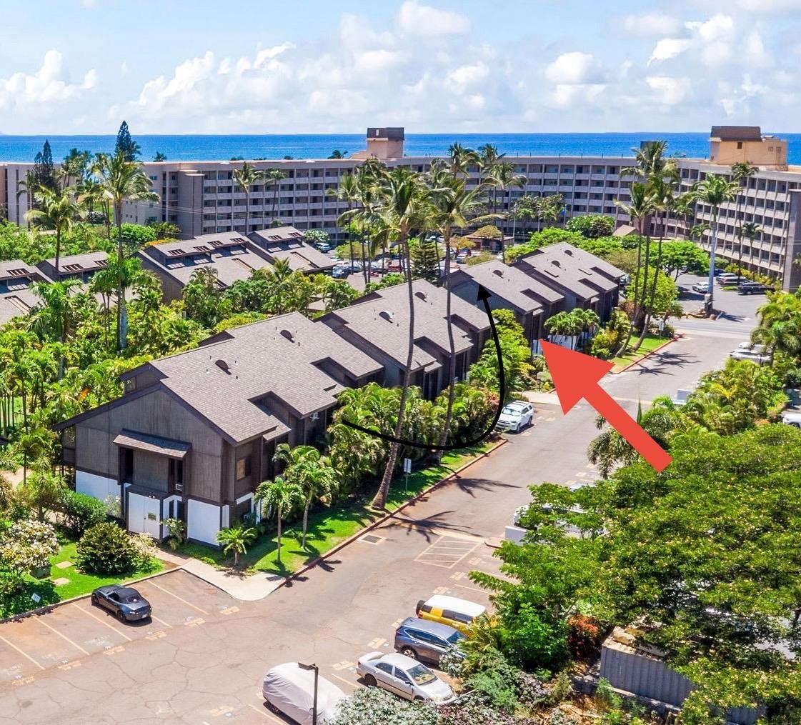 777 South Kihei Road, Unit 105 Kihei, HI 96753 - Photo 23 of 27 an aerial view of a house with a yard and outdoor seating