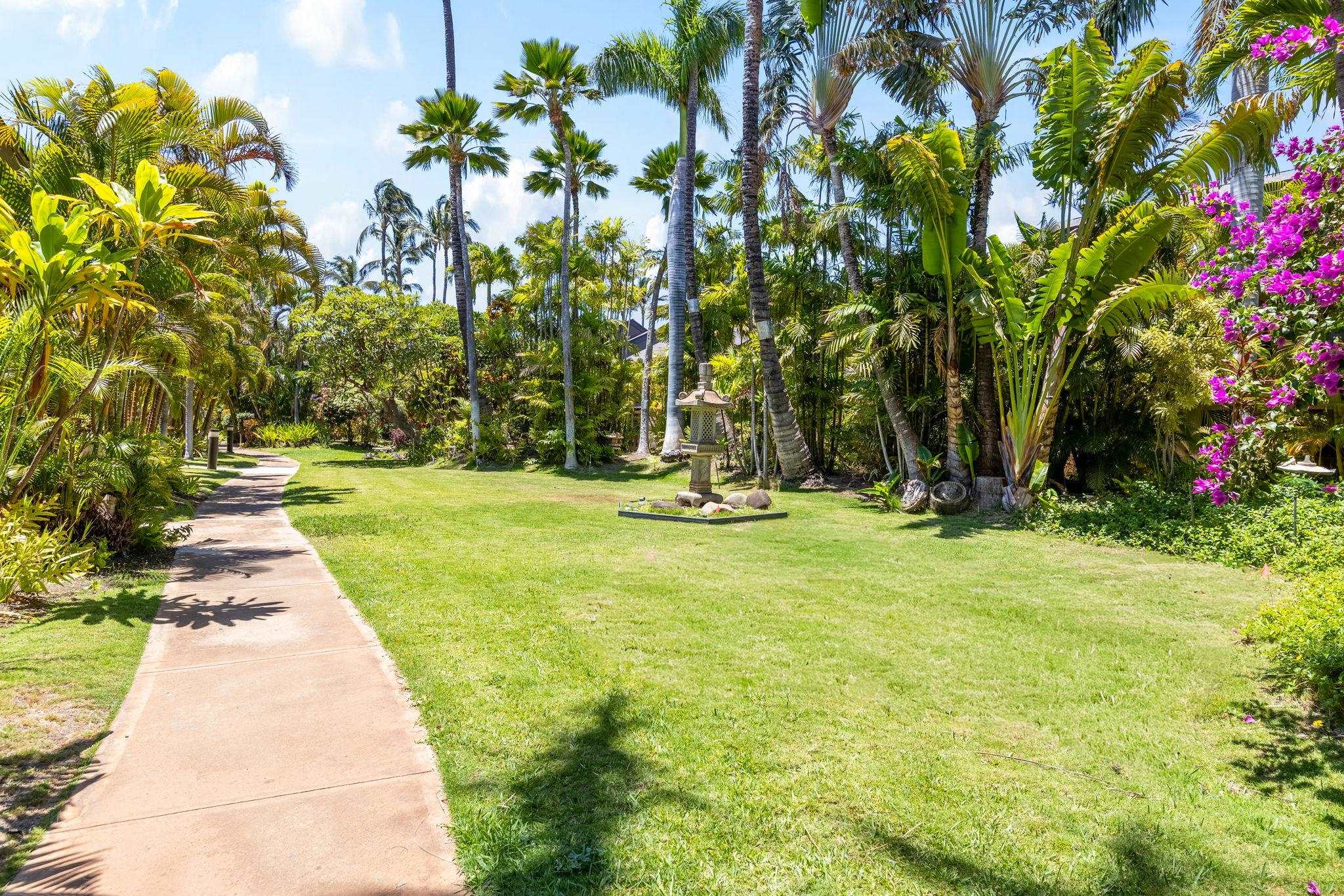 777 South Kihei Road, Unit 105 Kihei, HI 96753 - Photo 24 of 27 a swimming pool with outdoor seating and garden