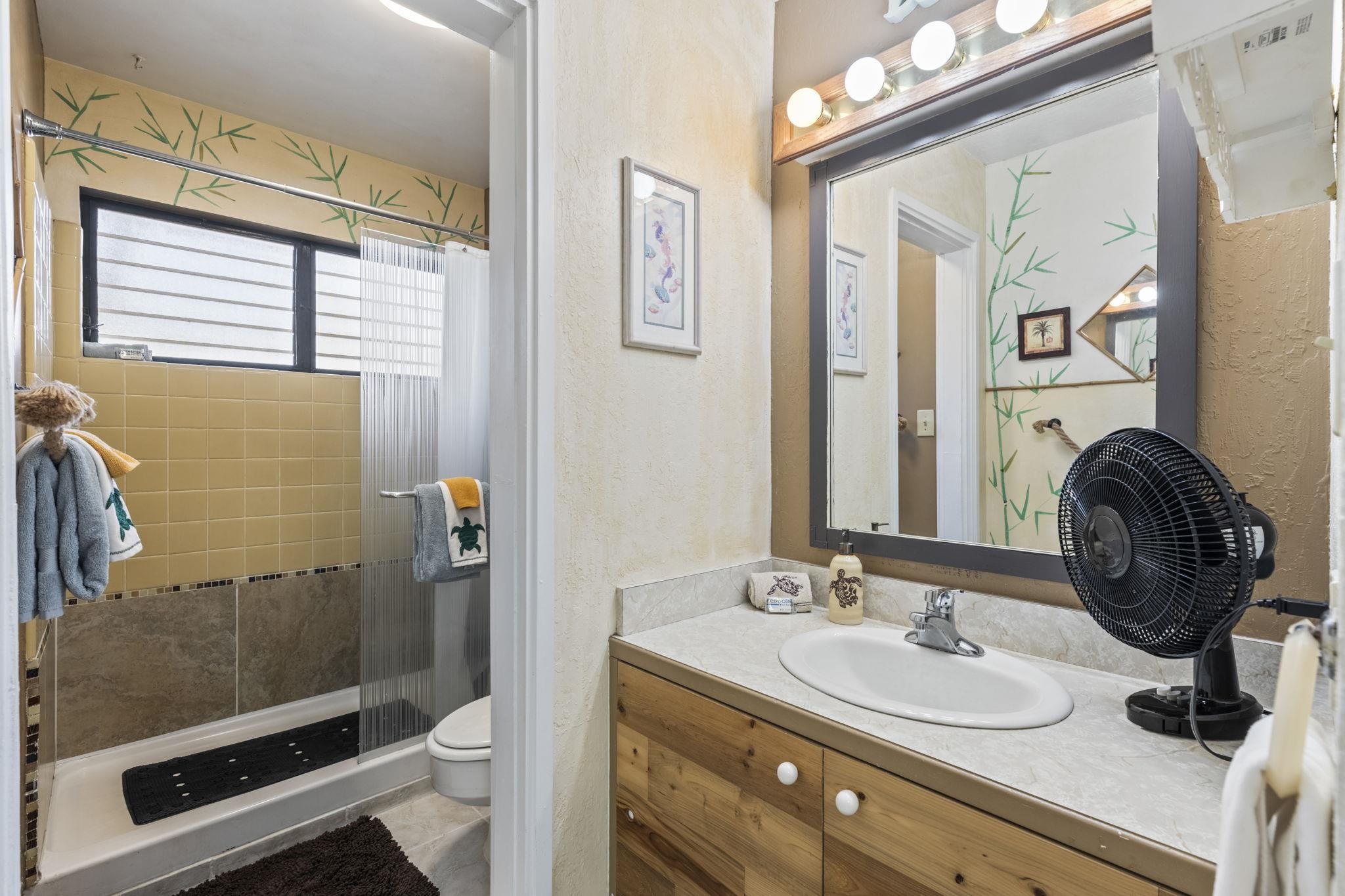 777 South Kihei Road, Unit 105 Kihei, HI 96753 - Photo 9 of 27 a bathroom with a sink double vanity and a mirror