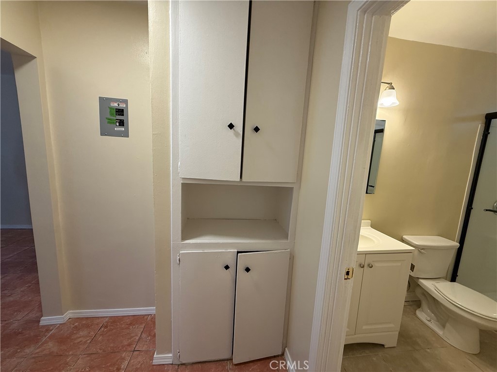 1805 South Rimpau Boulevard Los Angeles, CA 90019 - Photo 12 of 15 a bathroom with a sink and toilet