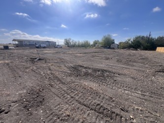 708 East Pecan Granger, TX 76530 - Photo 3 of 7 a view of a dry yard with trees