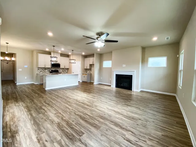 a bathroom with a sink mirror toilet and bathtub