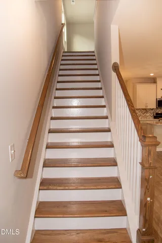 a bathroom with a sink vanity mirror and toilet
