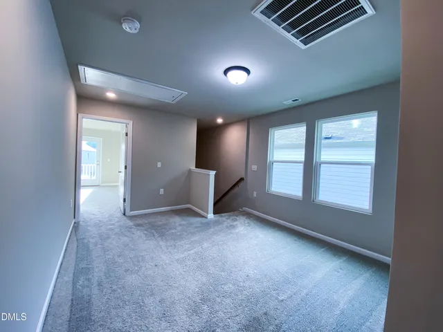 a bathroom with a double vanity sink and mirror
