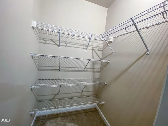 a view of a small space with wooden floor