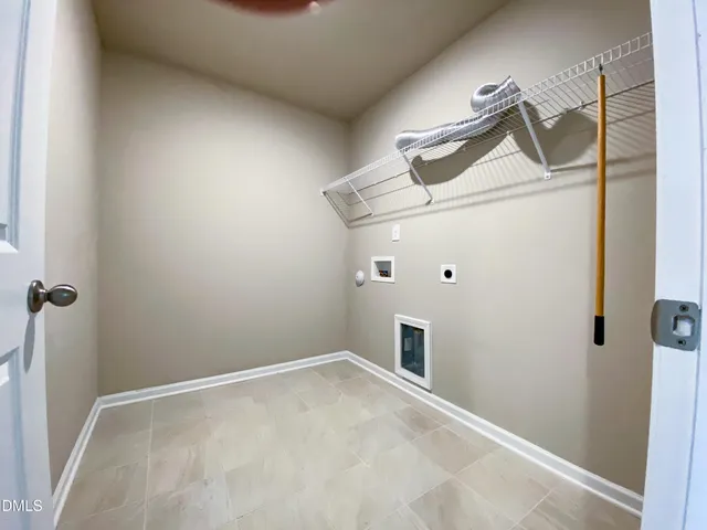 a large bathroom with a double vanity sink and a mirror