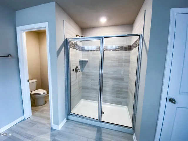 a bathroom with a sink a mirror and vanity