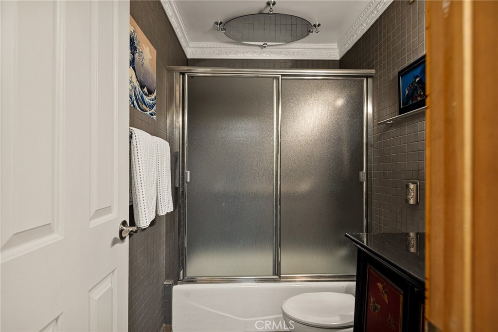 971 Grass Valley Road Lake Arrowhead, CA 92352 - Photo 28 of 50 a bathroom with a shower and toilet