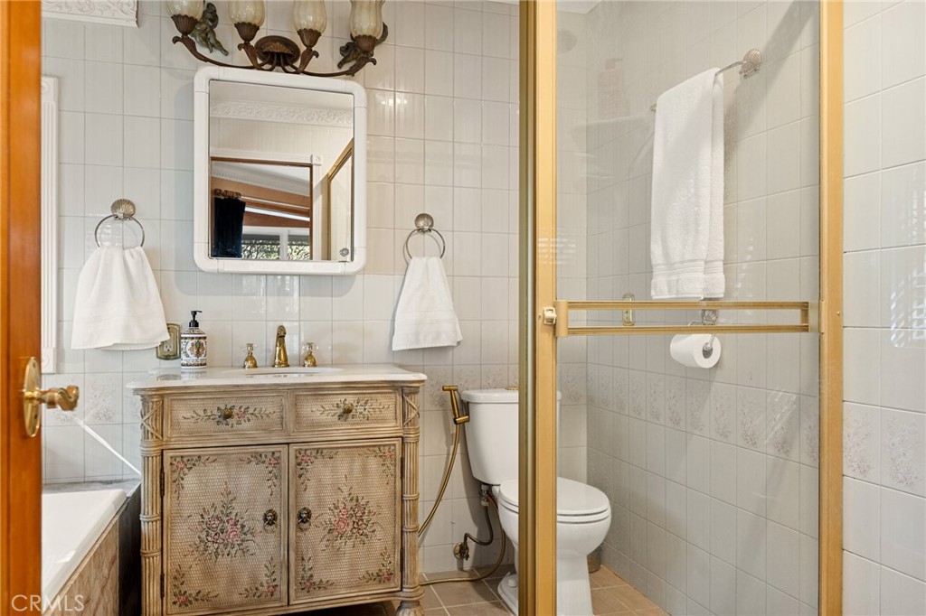 971 Grass Valley Road Lake Arrowhead, CA 92352 - Photo 38 of 50 a bathroom with a granite countertop sink toilet and shower