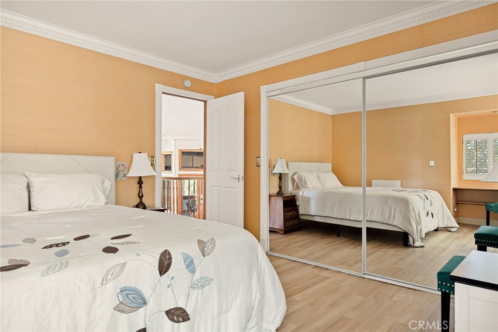 971 Grass Valley Road Lake Arrowhead, CA 92352 - Photo 41 of 50 a bedroom with a bed and wooden floor