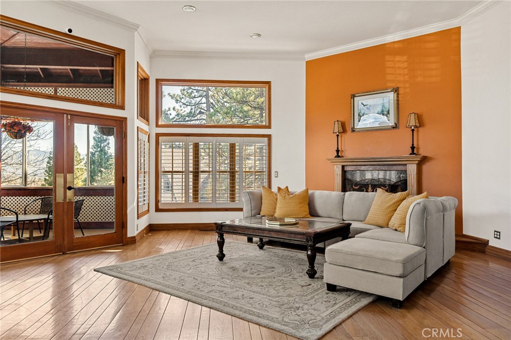 971 Grass Valley Road Lake Arrowhead, CA 92352 - Photo 7 of 50 a living room with furniture and a fireplace