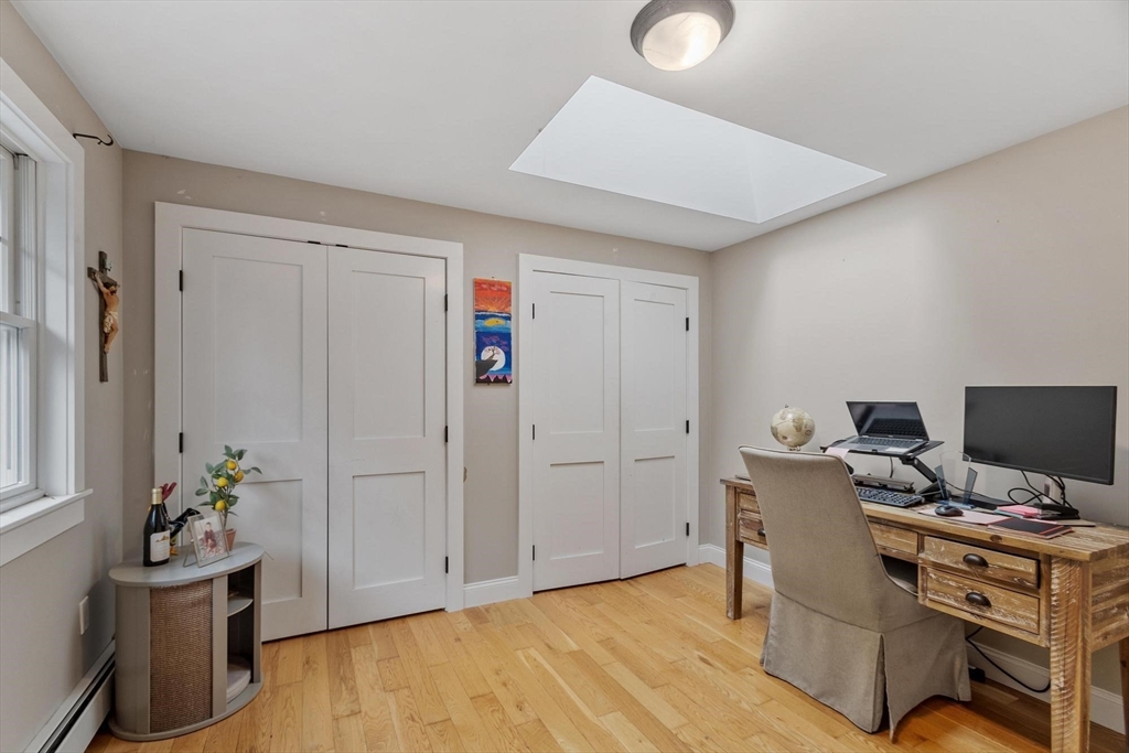 241 Reservoir Road Lunenburg, MA 01462 - Photo 27 of 40 a view of workspace with wooden floor and chair