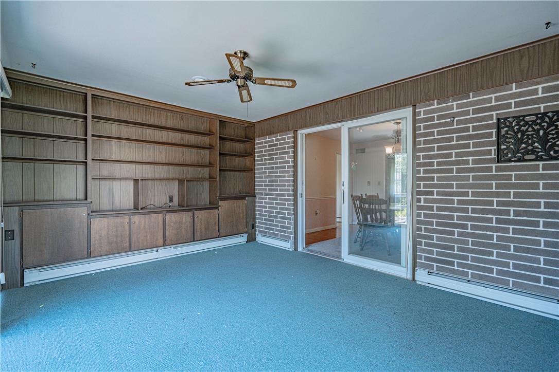 4815 Mill Road Schnecksville, PA 18078 - Photo 15 of 48 A versatile bonus room featuring extensive built-in shelving and convenient sliding glass doors.