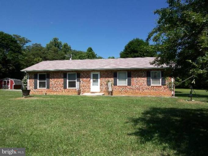 649 Kimble Road Berryville, VA 22611 - Photo 1 of 21 a front view of a house with a garden