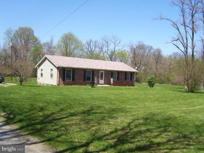 649 Kimble Road Berryville, VA 22611 - Photo 2 of 21 a front view of a house with garden