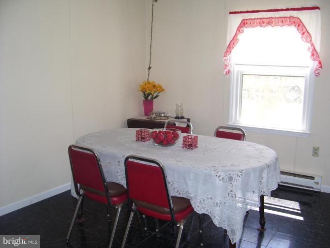 649 Kimble Road Berryville, VA 22611 - Photo 11 of 21 a dining room with furniture and window