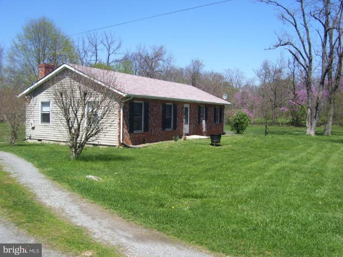 649 Kimble Road Berryville, VA 22611 - Photo 3 of 21 a view of a house with a yard porch and tree