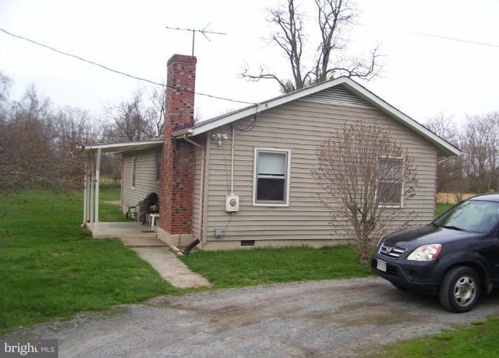649 Kimble Road Berryville, VA 22611 - Photo 4 of 21 a car parked in front of a house