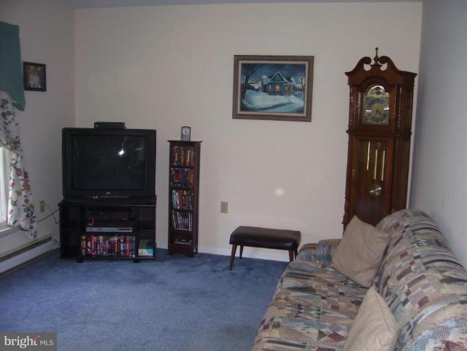 649 Kimble Road Berryville, VA 22611 - Photo 6 of 21 a bedroom with furniture and a flat screen tv