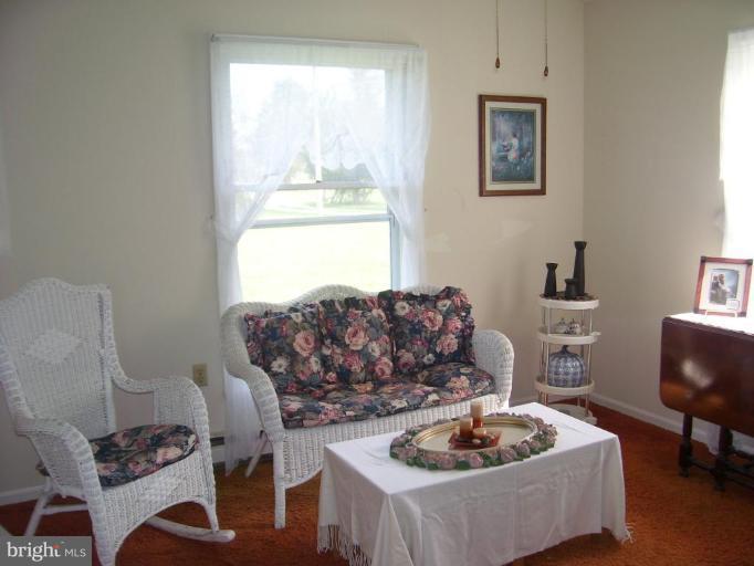 649 Kimble Road Berryville, VA 22611 - Photo 8 of 21 a living room with furniture and a table