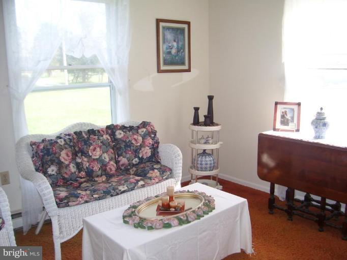 649 Kimble Road Berryville, VA 22611 - Photo 9 of 21 a living room with furniture and a table