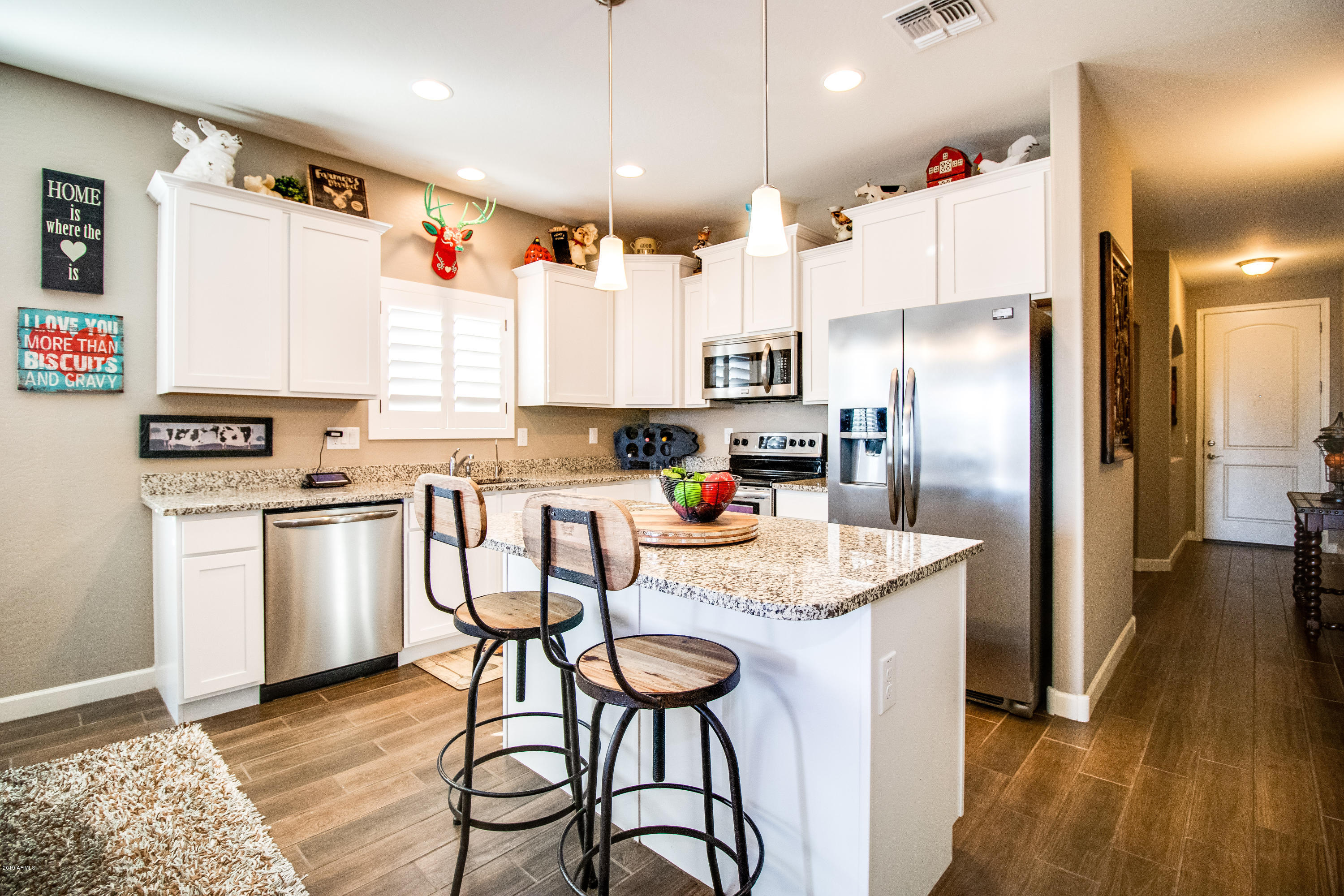 23635 West Ripple Road Buckeye, AZ 85326 - Photo 6 of 40 Kitchen w/ white staggered cabinets